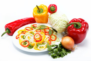 Healthy food. Fresh vegetables and salad on a white background.