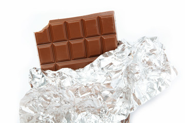 Chocolate bar in foil isolated on white background