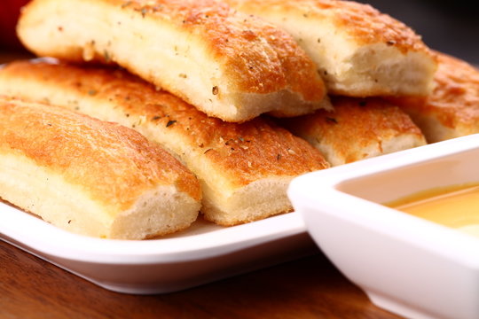 Fresh Breadsticks Served With Dip Sauce.