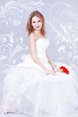 Fototapeta na wymiar A young woman in a white wedding dress