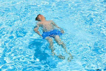 boy swimming in the pool