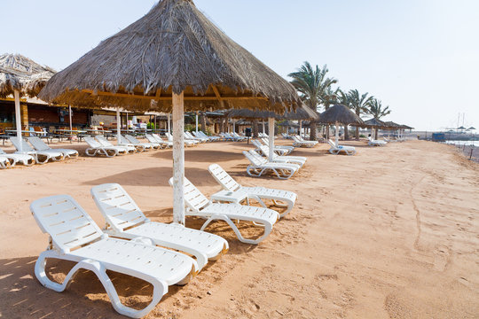 plastic beach beds on coral bay in Aqaba