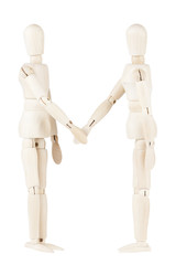 Wooden dummies shaking hands
