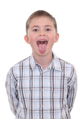 Boy with tongue out of mouth