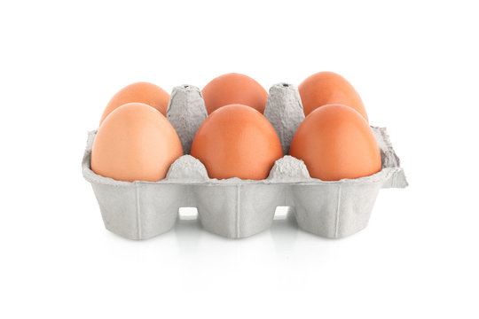 six eggs in carton box isolated on the white background