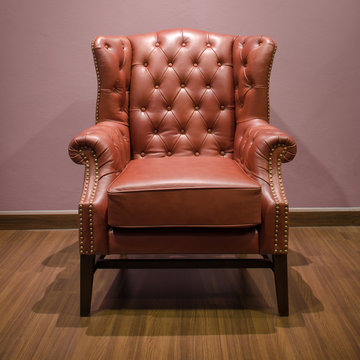 Front Of Classic Chesterfield Luxury Brown Leather Armchair