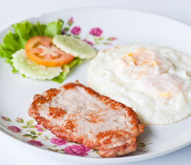 pork steak with fried eggs