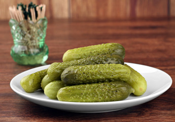 Dill Pickles on a plate, close up.