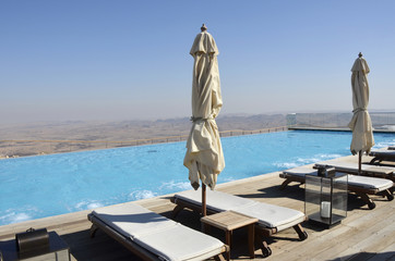 Obraz premium Pool solarium in tourist hotel, Negev desert.
