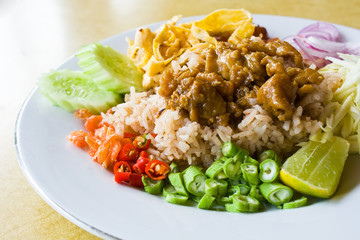 Mixed cooked rice with shrimp paste sauce on table