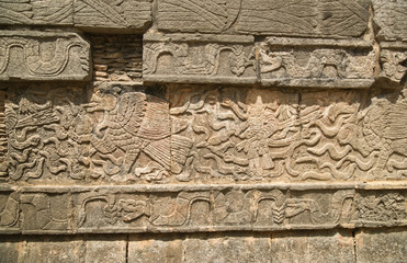 Mayan figures carved into wall at Chichen Itza in Mexico