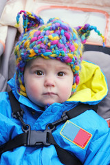kid in a knitted hat with ears