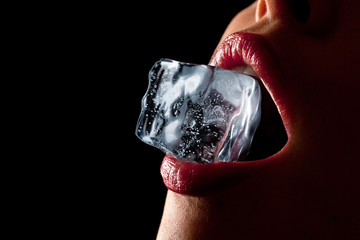 Fototapeta Ice cube in woman's mouth. obraz