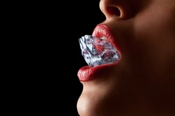 Ice cube in woman's mouth. © Fisher Photostudio