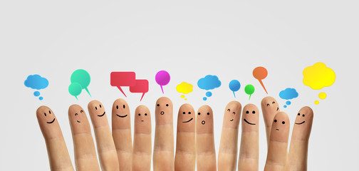 Happy group of finger smileys with social chat sign