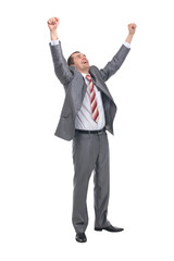 Excited handsome business man with arms raised in success