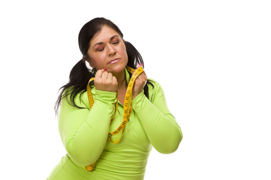 Frustrated Hispanic Woman With Tape Measure