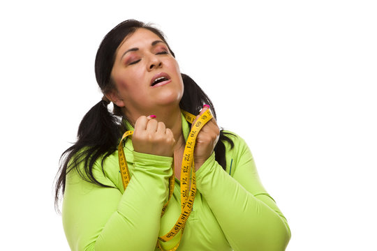 Frustrated Hispanic Woman With Tape Measure