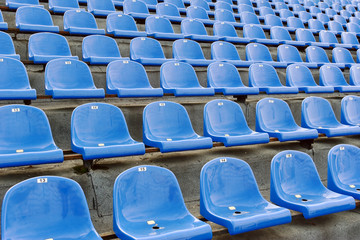 Blue stadium seats with numbering