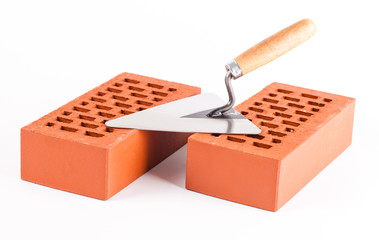 bricks and trowel on white background