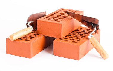 bricks and trowels on white background