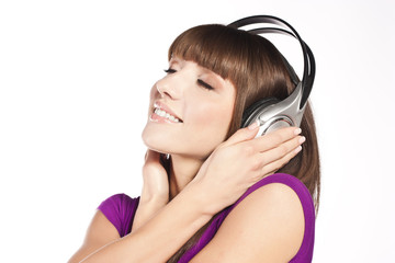 Fototapeta premium Pretty young woman listening music