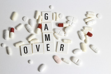 game over text with pills