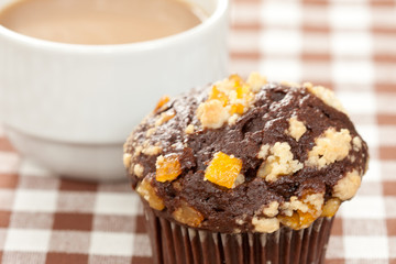 Chocolate orange muffin and coffee cup