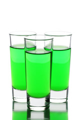 three glasses of absinthe isolated on white
