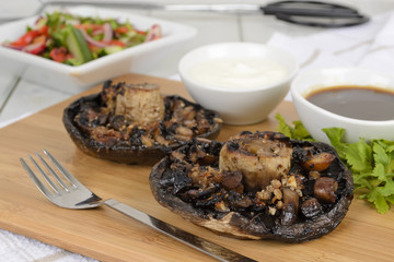 Grilled mushrooms with salad BBQ sauce and and sour cream dip