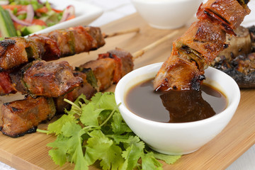 Pork kebabs with peppers. Salad, grilled mushroom & BBQ sauce