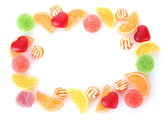 frame of colorful jelly candies isolated on white
