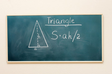 Math formulas written on the desk