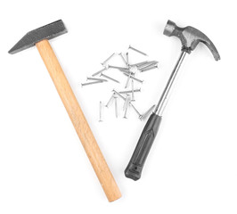 Hammers and metal nails isolated on white
