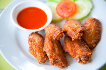 deep fried spicy chicken wing with chili sauce
