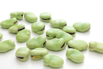 Broad beans on white background