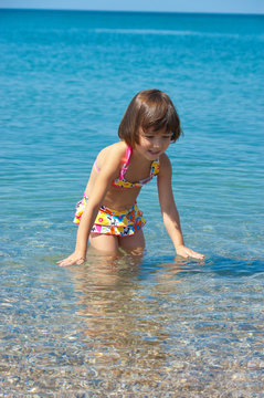 Family summer beach vacation. Happy active child having fun