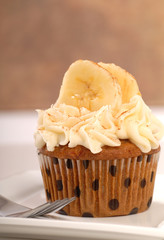 Delicious carrot cake cupcake with cream cheese frosting, sliced