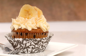 Delicious carrot cake cupcake with cream cheese frosting, sliced