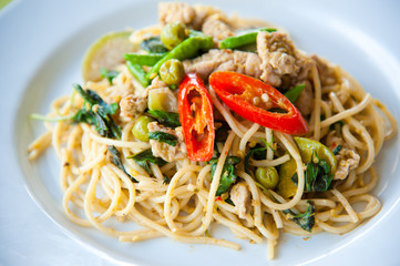 tasty spice spaghetti with green curry, cream, cheese