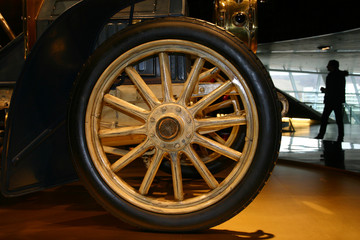 Wheel from the ancient car and the person