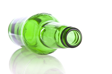 Green glass bottle isolated on a white background