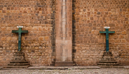 Two crosses at the outer wall of the Cathedral in Cusco, Peru