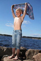 the small boy on a sunny beach