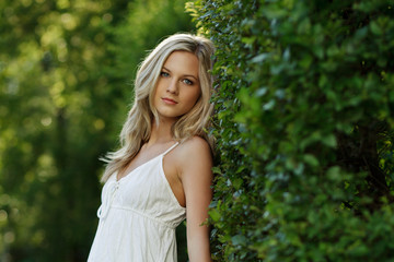 Naklejka premium Beautiful Blond Girl With Trees, White Dress