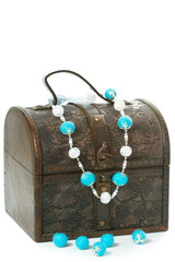 Old wooden jewelry box with necklace