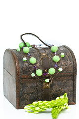 Old wooden jewelry box with necklace