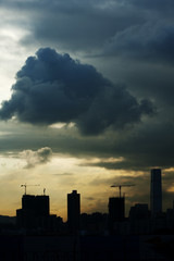 Fototapeta na wymiar The Hong Kong City skyline framed by dramatic storm clouds