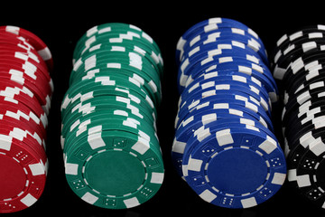 Casino chips isolated on black