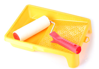 Paint roller with tray isolated on white close-up